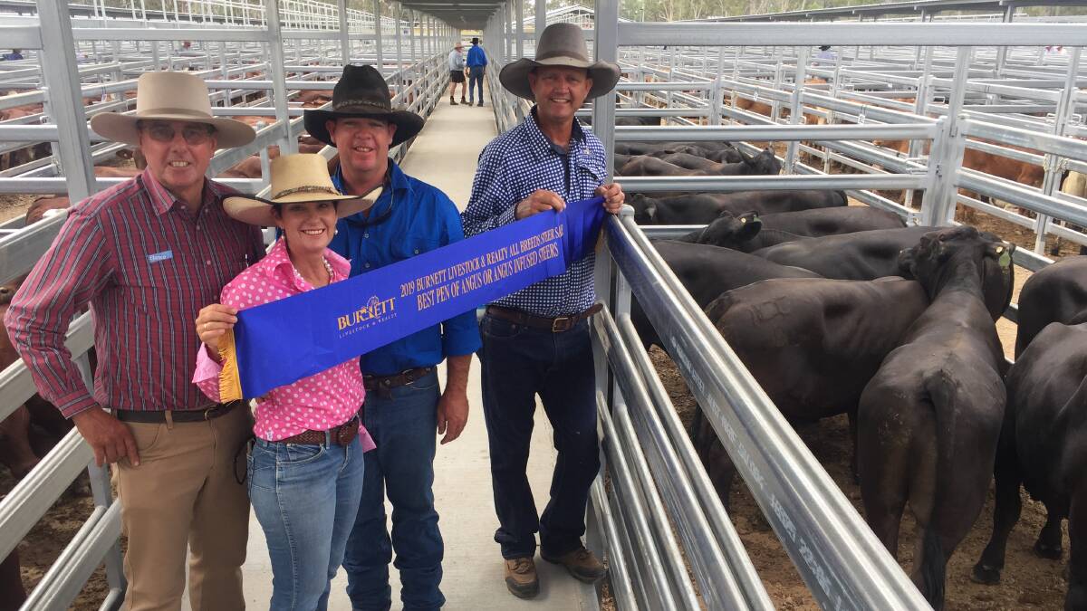 Link and Tracy Davies, Mundubbera, claimed top honours in both the Angus and Brahman classes. The Davies are pictured with sponsor Peter Ramsey, Elanco, and Lance Whitaker, Burnett Livestock. 