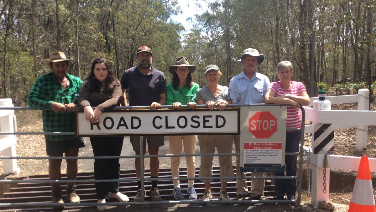 Boonah landholders Bruce Wagner, Trinity Cottrell, Brett Nagel, Suzanne Ramsden, Cheryl Jonathan, Robert Staszewski and Hilary Roberts at the entry to the Mount French section of Moogerah Peaks National Park. 