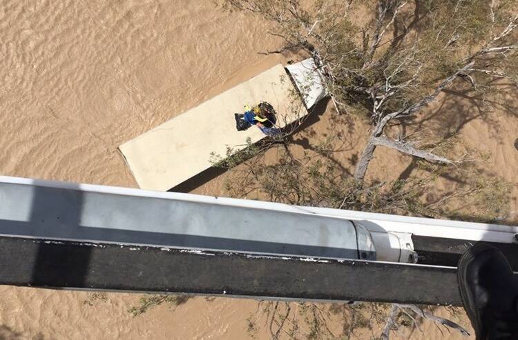 HELICOPTER RESCUE: A man was rescued from the top of his truck this afternoon, after he was trapped in flood waters for more than 14 hours.