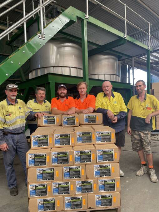 Andrew Butler and Ty Horne, Oz-Tac Engineering, Gympie, with Daniel and Josh Olsson, Nigel McKinnon, and Sam McDowell, AgCoTech, and the mixing machine to be used in Laos.