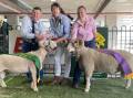 Lyndon Fry and Tara Kempston, Silverdale Dorset Stud, Inglewood, with the champion and reserve champion Dorset Horn rams with judge Leslie Brewer (centre).