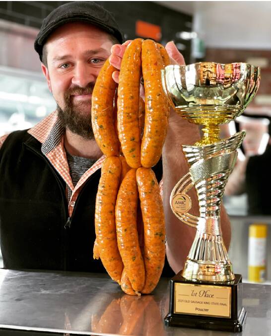 POULTRY SAUSAGE: Meat at Billy's Rosalie store manager Ben Webb with the award winning butter chicken sausages.