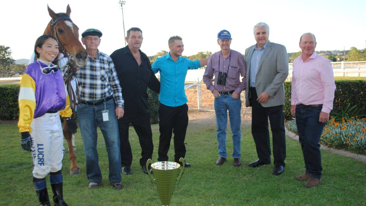 NOLAN MUSTER CUP WINNER: Eight year old gelding Fasta Than Lightening with jockey Miki Nakao, Cedric Duff, owners Glen Abbott and his son Nathan, trainer Pat Duff, sponsor Terry Nolan, and Gympie Turf Club president Shane Gill. 