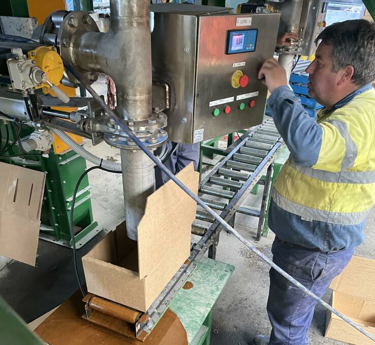 Ty Horne from Oz-Tac Engineering in Gympie checking over the controls of the mixing machinery on its way to Laos. 
