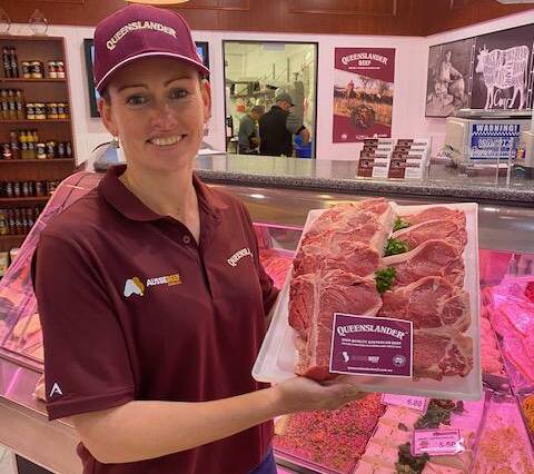 Kimberly Thomas from Queensland Country Meats, Roma, with JBS's Queenslander brand T-bones.