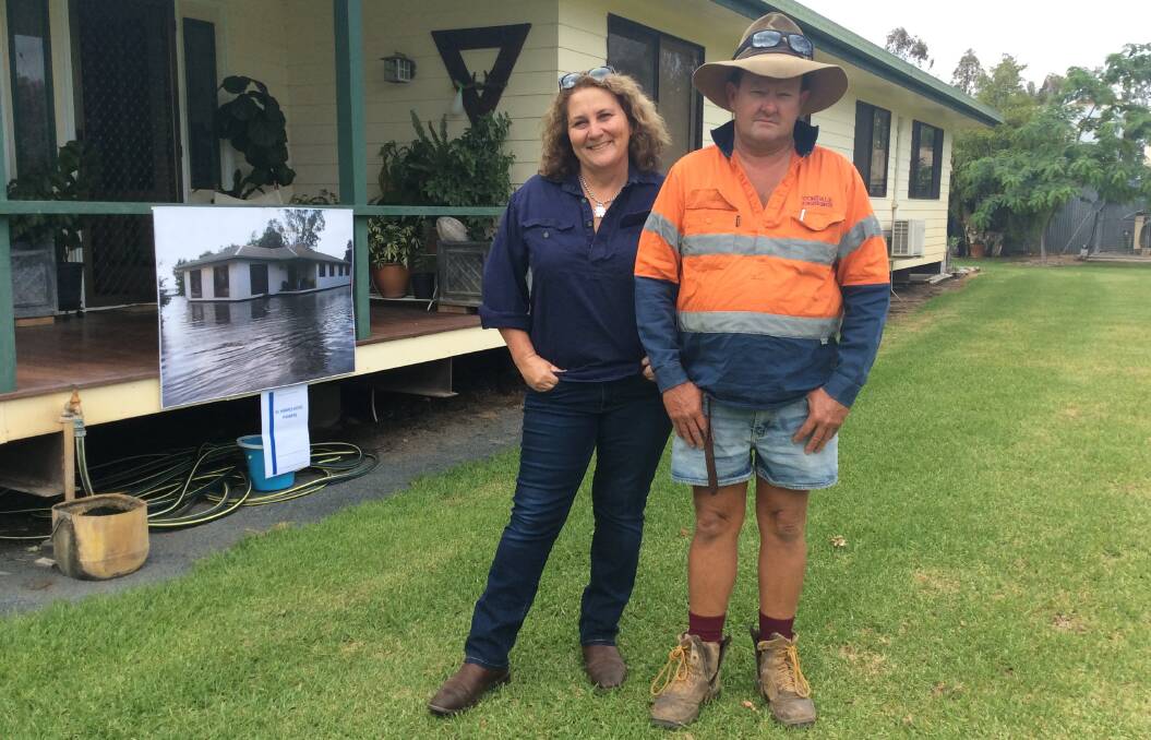 Pampas farmers Bronte and Ross Harris show what ARTC's computer modeling says is impossible - floodwater impacting on their home.