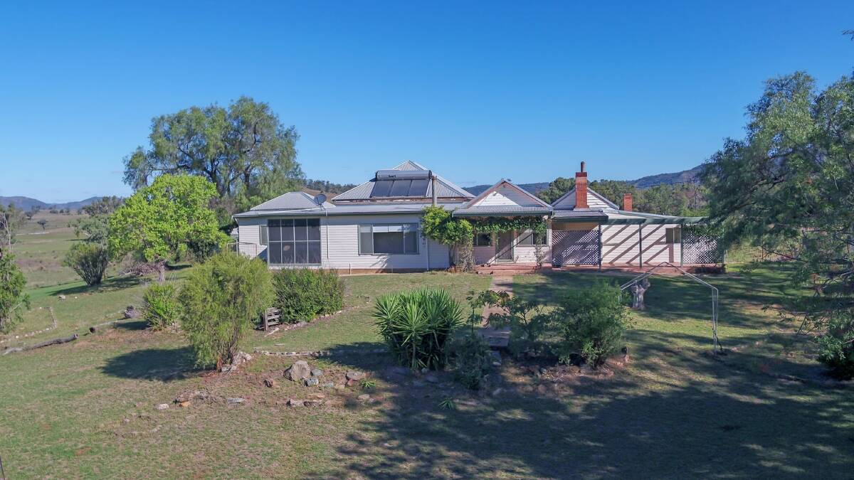 The large, neat and tidy three bedroom weatherboard homestead has views overlooking the productive creek flats. Picture supplied
