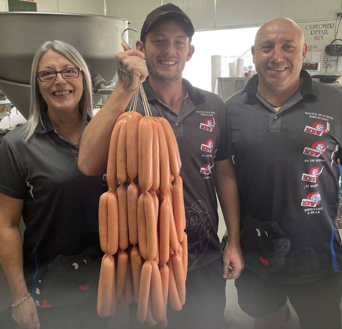 TRADITIONAL BEEF: Karen Rix and Don Cameron with gun sausage maker Ryan Barke, MBW. 