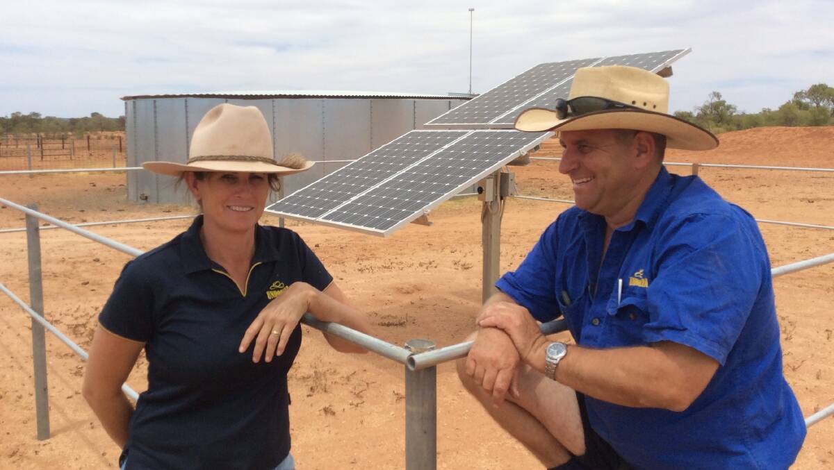Nicole and Ben Hayes with one of their numerous solar equipped bores.